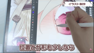 甘狼このみの実写。顔を描いているときの手が映っている。